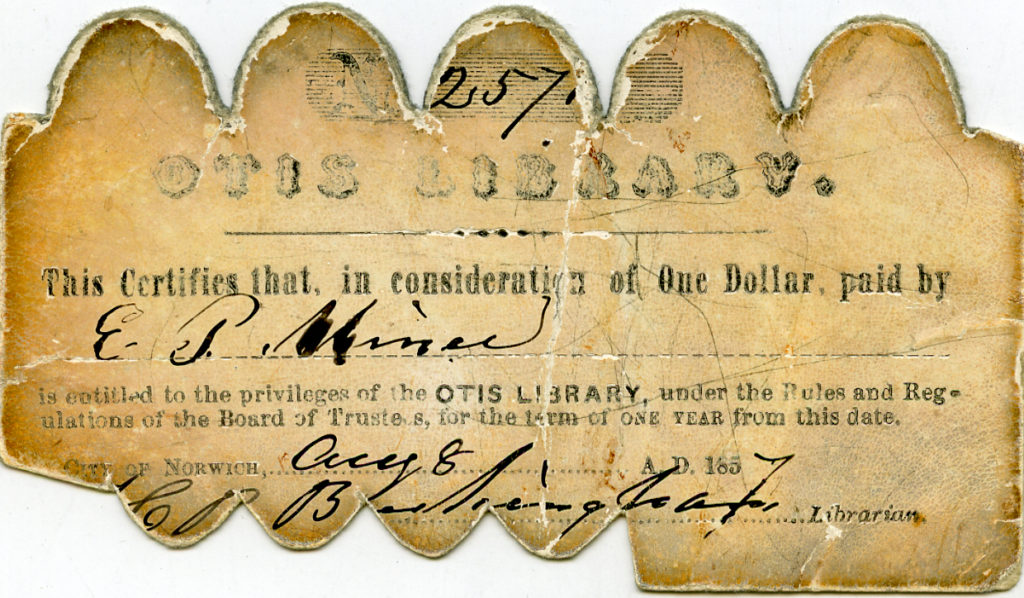 One of the first library cards from Otis Library, it is dated to 1857 and is poor condition. There are scalloped edges and tears making it difficult to read everything on the card.