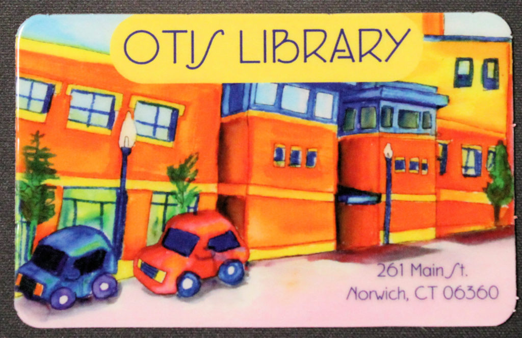 Our current card! The front of this card is a watercolor painting of the exterior of the library. It is painted in vibrant orange and reds, with blue accents. The back in white with a barcode for the online system and a place for the cardholder to sign it.